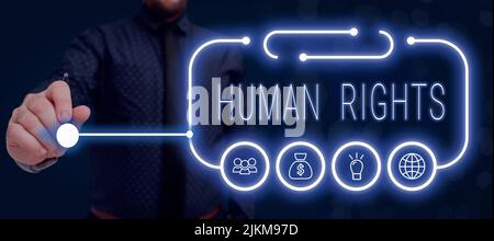 Signature manuscrite droits de la personne. Photo conceptuelle principes moraux normes normes d'une démonstration protégée par la loi homme d'affaires tenant Pen et présentant Banque D'Images