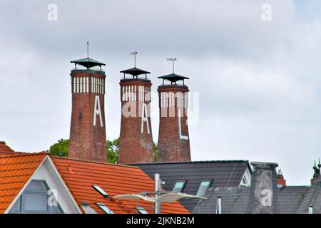 Three chimneys of a fish ingress in Kappeln at the Schlei in Northern Germany Stock Photo