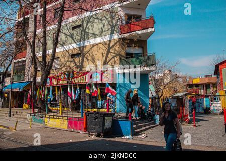 A photo of people and Characteristic colored houses of Caminito, la Boca, Buenos Aires Argentina Stock Photo