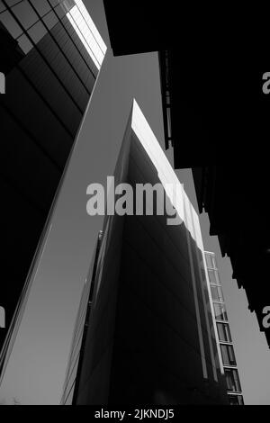 A vertical low angle grayscale shot of the modern architecture of South Bank, London Stock Photo