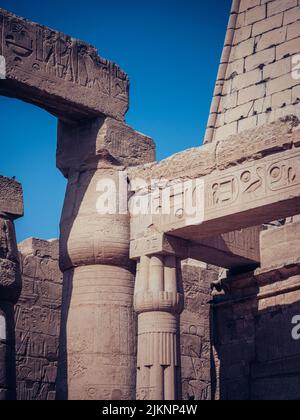 A vertical shot of the ruins of the ancient Karnak temple in Luxor, Egypt Stock Photo