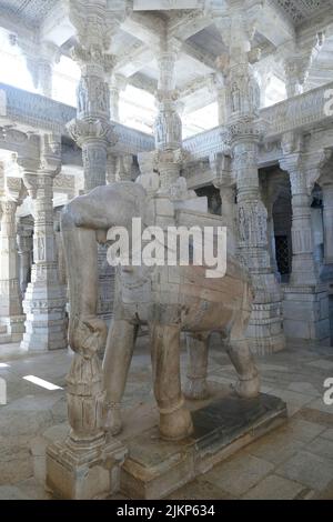 A vertical shot of a sculpted elephant in the Ranakpur Jain temple in India Stock Photo