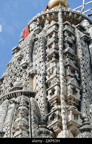 A vertical shot of an intricate sculpted pillar at the Ranakpur Jain temple in India Stock Photo