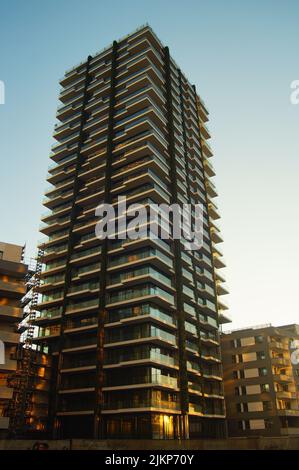 The just completed 'EDEN' tower against the evening light.  The greening of the facade has been carried out. New addition to the Skyline 2021. Stock Photo