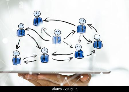 A 3D rendering of human figures connected with lines above a tablet Stock Photo