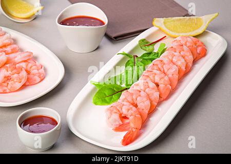 A closeup shot of shrimp Cocktail (Prawn cocktail) in white plates on the table Stock Photo