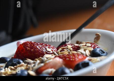 A close up of breakfast muesli topped with beries Stock Photo