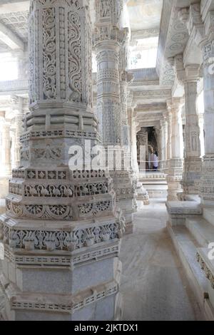 A vertical shot of the columns in the famous Ranakpur Jain Temple in India Stock Photo