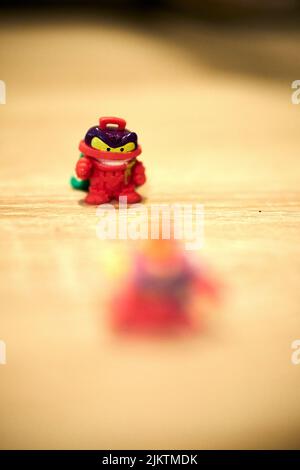 A selective focus of Magicbox brand Super Things trash bin-shaped toy figurine of the villain team Stock Photo