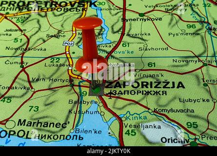 A closeup of a red pin on the map of the Zaporojie city in Ukraine Stock Photo
