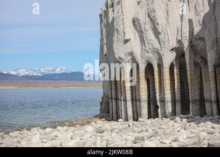 The unique stone columns at the edge of Crowley Lake Reservoir is a surreal destination to visit. Stock Photo