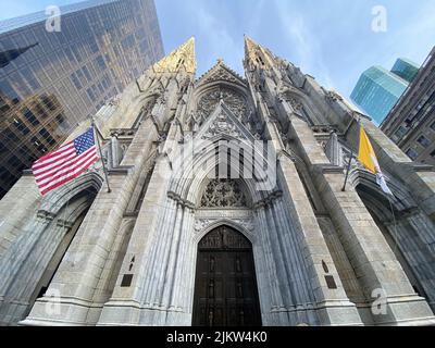 A low angle shot of St. Patrick's Cathedral in New York, the USA in cloudy sky background Stock Photo