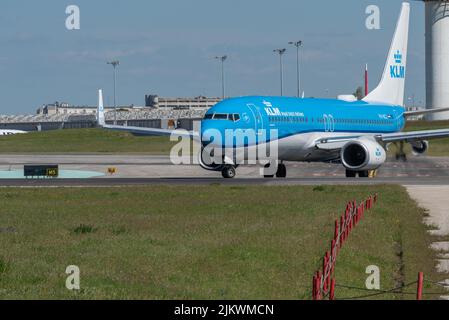 The Boeing 737-8K2 plane of the airline KLM moving on the runway at Lisbon airport Stock Photo