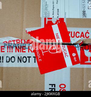 A delivery box with tape and sticker warning for fragile items Stock Photo