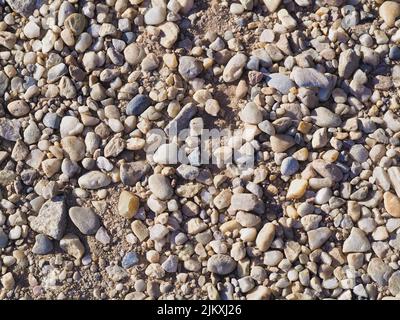 Different Sized and Shaped Stones on the ground, ideal for backgrounds wallpapers Banque D'Images
