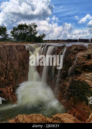 A beautiful shot of an artificial waterfall created by spilling water in Sri Lanka Stock Photo