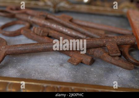 Old rusty rusty tiles at the flea market in Madrid (Spain), selective focus. Stock Photo