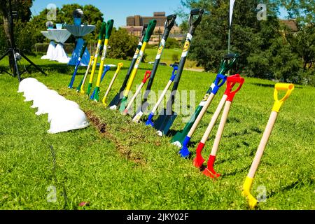 The spades and hard hats for the groundbreaking ceremonies. Johannesburg, South Africa - March 20, 2014: Stock Photo