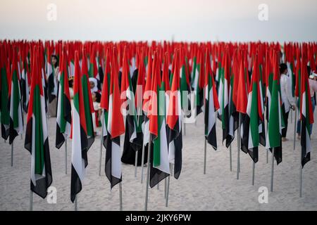 A bunch of UAE flags on poles on Kite Beach in Dubai Banque D'Images