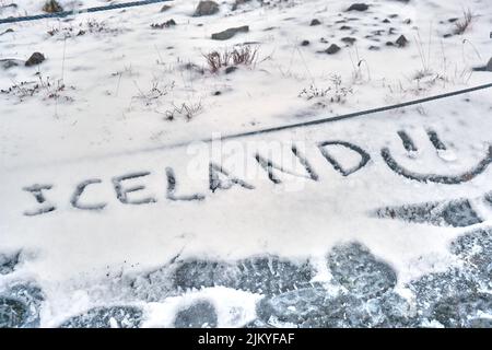 Iceland and smiley face drawn in snow Stock Photo