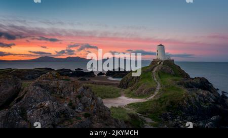 An aerial view of Lighthouse, Anglesey, Wales, UK Stunning sunrise looking over to Snowdonia Banque D'Images