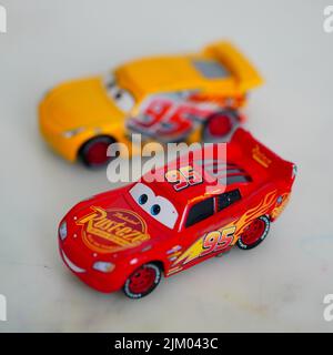 A selective focus shot of the Mattel Lightning McQueen toy model race car from the Disney Pixar Cars movie Stock Photo