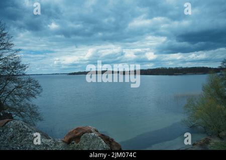 A blue clouds over the sea. Tinted seascape. Stock Photo