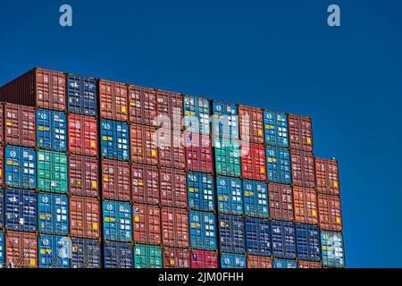A stack of shipping containers at the port of Oakland in San Francisco Bay Stock Photo