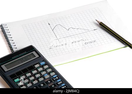 Graphique â€œcrisisâ€, crayon et calculatrice Banque D'Images