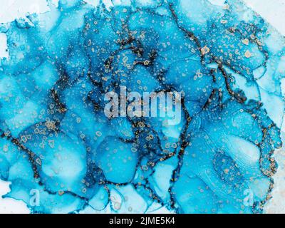 Fond d'art liquide à l'encre d'alcool, bleu et doré Banque D'Images
