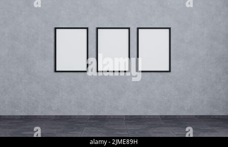 Trois cadres photo vides sur un mur en béton gris avec carrelage foncé. Maquette de cadres d'affiche. Chambre vide avec cadres d'affiche. Roo gris Banque D'Images