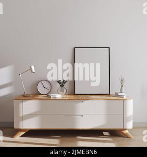 Cadre à affiche maquette dans un intérieur moderne de style scandinave sur une commode minimaliste avec décoration. Affiche ou cadre photo m Banque D'Images
