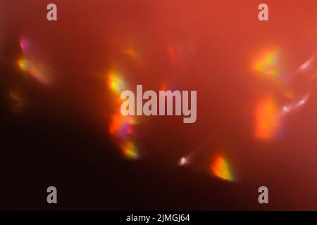 lumière de flou de l'objectif feux de bokeh rayons de soleil rouges flous Banque D'Images