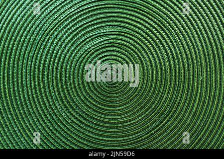 Texture de platemat tissé en plastique vert sur la table à manger, vue de dessus Banque D'Images