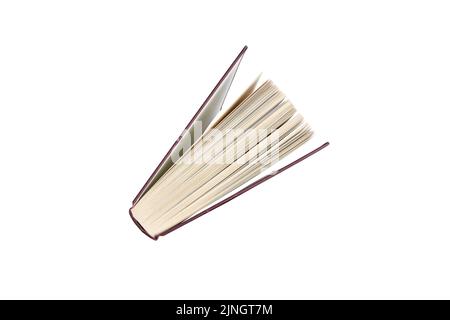 le livre en hardback était à l'extrémité en regardant vers le bas depuis le haut. Isolé sur un arrière-plan blanc avec un masque Banque D'Images