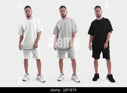 Maquette de costume large blanc, noir, chiné tendance, t-shirt pour homme, short sur un type de sneakers, vue avant, isolé sur l'arrière-plan. Modèle m Banque D'Images