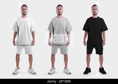 Modèle de t-shirt blanc, noir, chiné grand, short sur un homme posant brutal dans des baskets, devant, isolé sur fond. Ensemble de vêtements. Cl. Mâle Banque D'Images