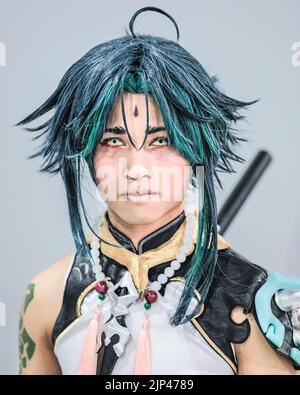 Cosplayer comme Xiao de Genshin impact, un jeu de rôle chinois ouvert-monde personnage de jeu, portrait, MCM Comic con London Banque D'Images