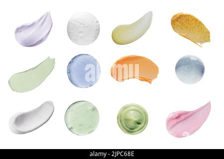 Taches de différentes couleurs produits cosmétiques isolés sur un fond blanc. Texture d'une nuance multicolore de divers cosmétiques de maquillage et d'entretien Banque D'Images