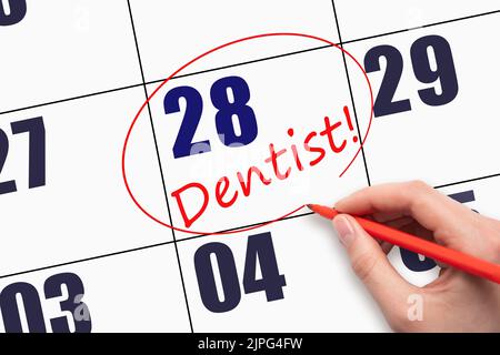 28th jour du mois. Rédiger du texte à la main DENTISTE et encercler la date du calendrier. Dentiste soins de santé Calendrier médical concept de rendez-vous. Jour du Banque D'Images