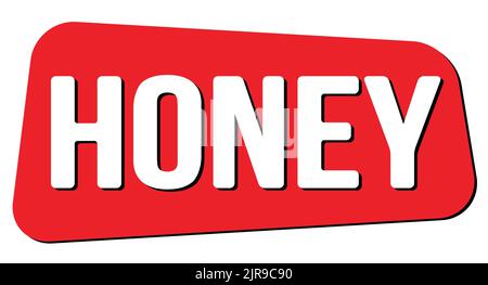 TEXTE EN MIEL inscrit sur l'enseigne rouge en forme de trapèze. Banque D'Images