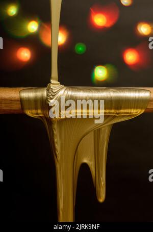 Des gouttes d'or liquide et des lumières Banque D'Images