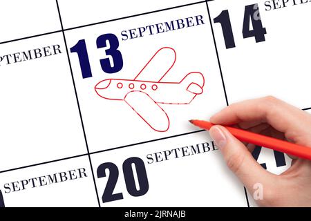 13th jour de septembre. Un dessin à la main esquisse de l'avion à la date du calendrier 13 septembre . Date du vol en avion. Voyages, voyages d'affaires. Automne Banque D'Images