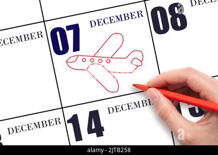 7th jour de décembre. Un dessin à la main de l'avion à la date du calendrier 7 décembre. Date du vol en avion. Voyages, voyages d'affaires. Mois d'hiver Banque D'Images