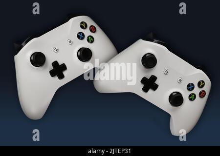 Deux gamepads de jeu en vol sur fond bleu dégradé Banque D'Images