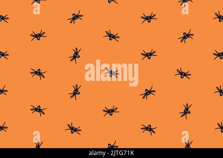 Motif Halloween crépiteux avec araignées noires sur fond orange. Art visuel Banque D'Images