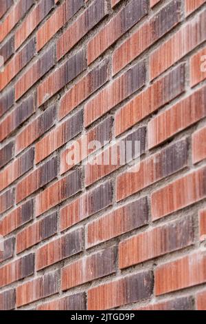 Mur rugueux de briques rouges brunes robustes gros plan Banque D'Images