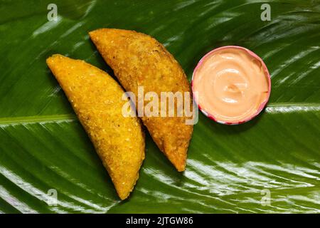 délicieux empanada à base de maïs et farci de viande et de pommes de terre Banque D'Images