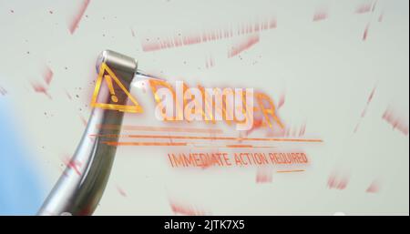 Image du texte danger sur la perceuse dentaire Banque D'Images