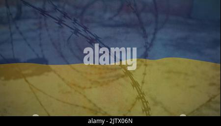 Image du drapeau de l'ukraine sur le terrain et le fil barbelé Banque D'Images